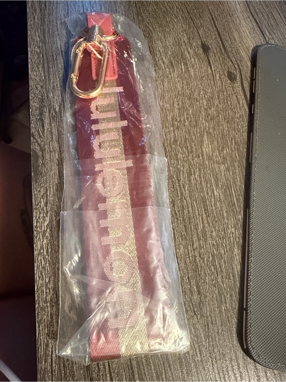 lululemon athletica Red and Gold Logo Wristlet Strap